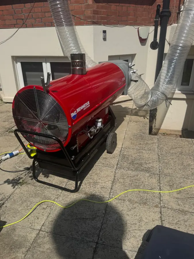 Close-up of the BM2 Biemmedue industrial heater fan and ducting during a bed bug heat treatment